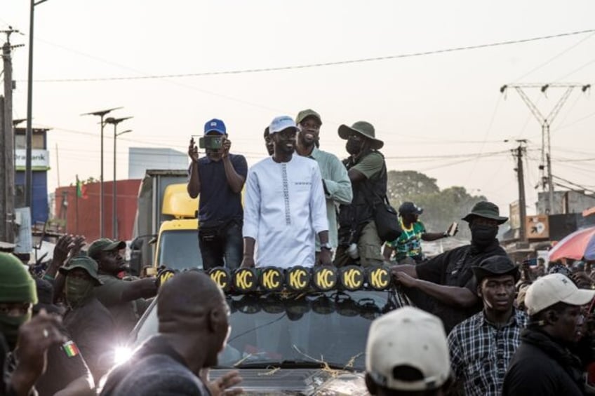 Senegal opposition leader Ousmane Sonko (R) and his ally and presidential candidate Bassir