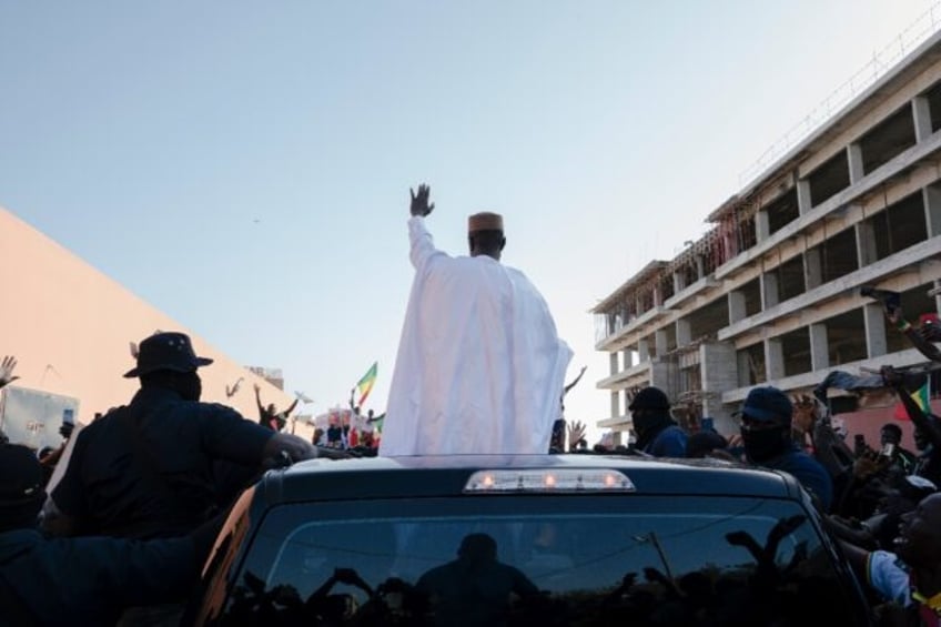 Hundreds of people turned out to greet Sonko and Diomaye, the man he has endorsed in the p