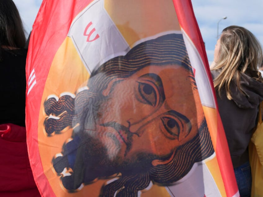 A flag during a student-led 24 hour block on an intersection to protest the deaths of 15 p