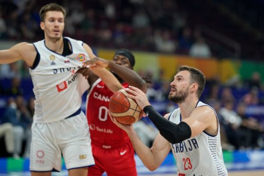 serbia runs past canada 95 86 and reaches the gold medal game at the basketball world cup