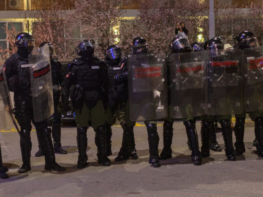 CORRECTS DATE TO MONDAY - Serbian law enforcement stand as hundreds of students block the