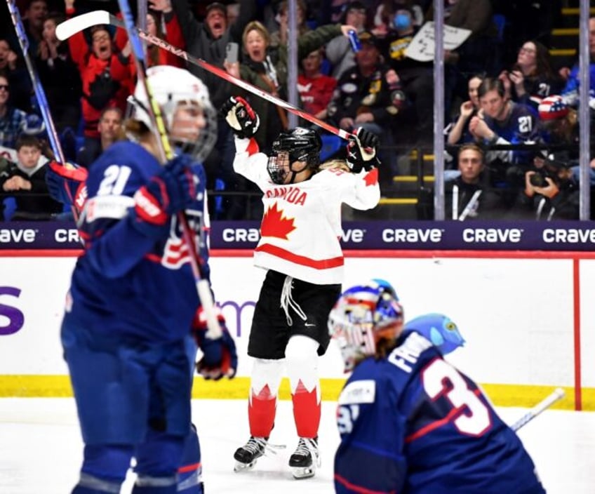 Canada's Danielle Serdachny celebrates her gold medal-winning goal in overtime against the