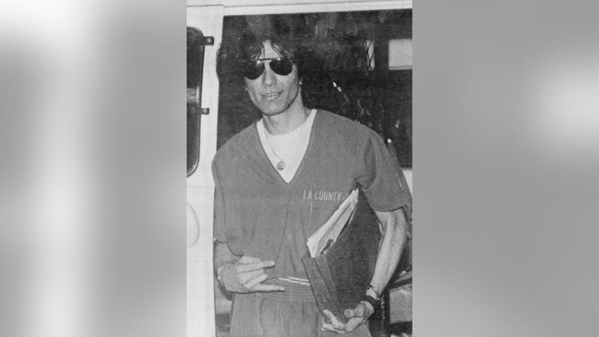 Richard Ramirez in a jumpsuit wearing sunglasses