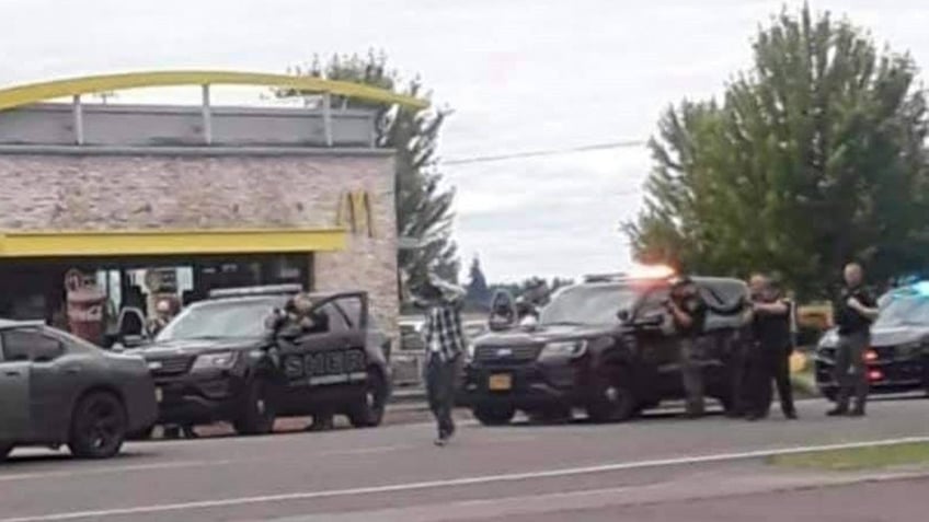 Frederic Rogers arrested by SWAT team outside a McDonald's in Oregon