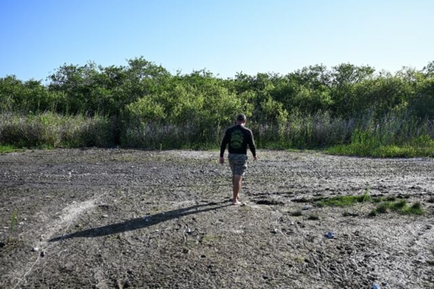 Owner of Mack's Fish Camp Marshall Jones walks through the drought-stricken Everglades Nat