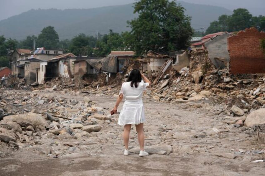 severe floods in chinas northern province killed 29 and caused tens of billions of economic losses