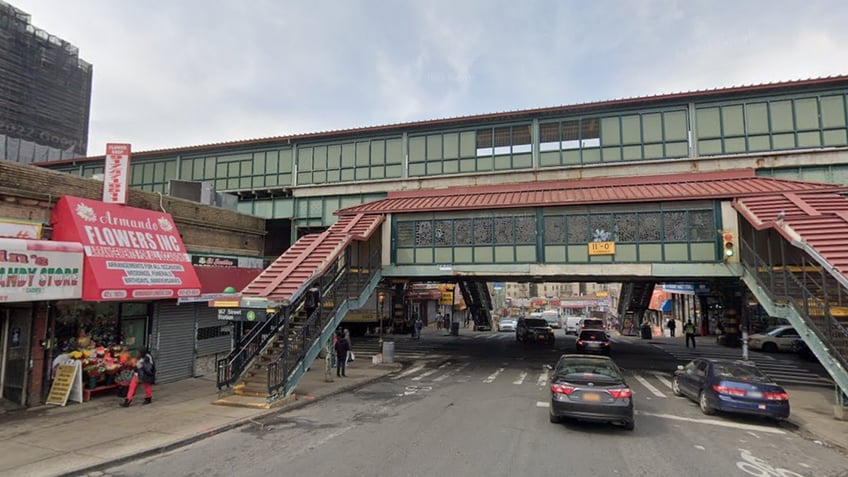 Subway station with cars on street and people passing by in New York