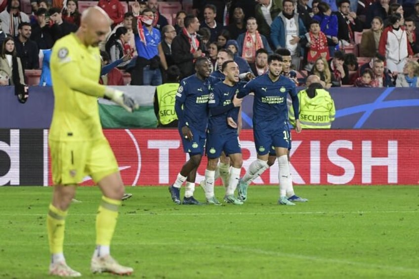 sevilla crash out of champions league after psv comeback