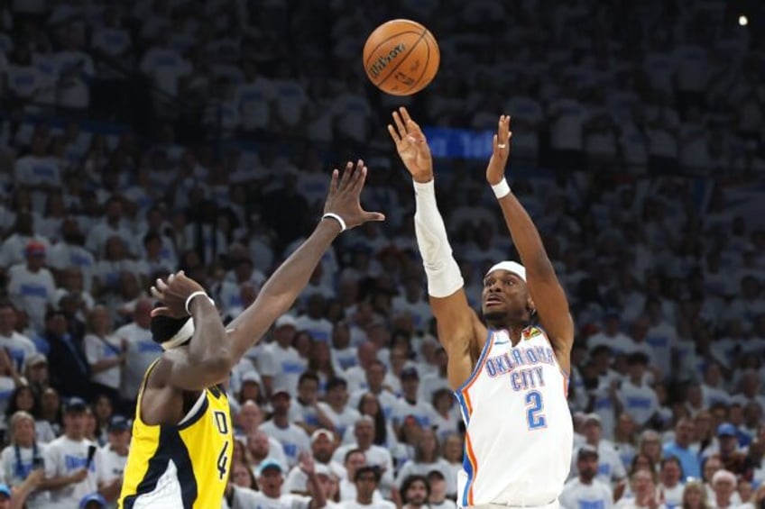 Oklahoma City's Shai Gilgeous-Alexander attempts a shot against Pascal Siakam in the Thund