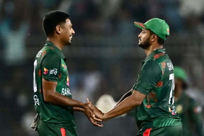 Shakib Al Hasan (R) helped Bangladesh defend a modest total against Zimbabwe