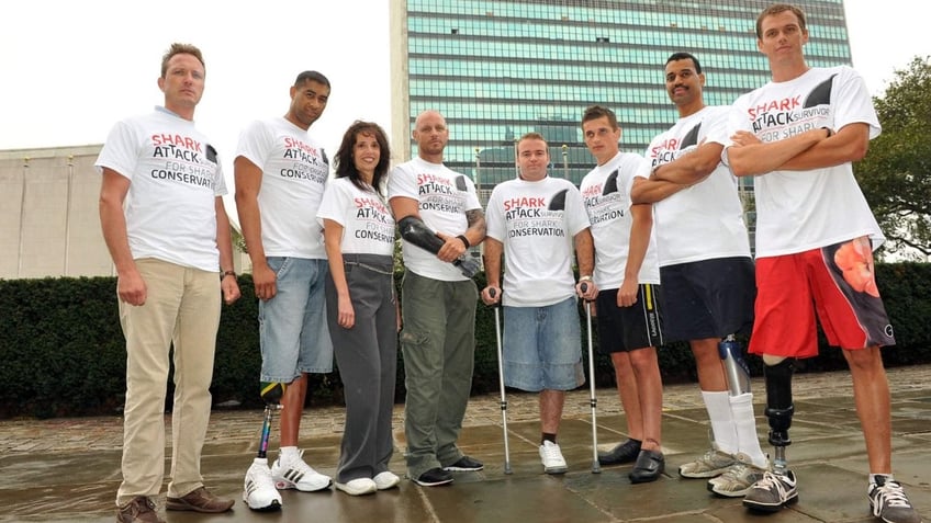 Debbie Salamone (second from left) is surrounded by other shark attack survivors advocating for sharks and pushing conservation efforts.