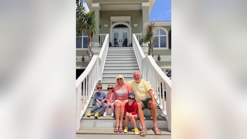 Chuck Anderson prayed when he was underwater in the shark's mouth to see his kids one more time. Now he's alive and surrounded by his family.