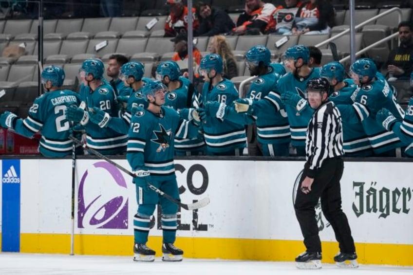 sharks end record tying 11 game skid to start season with 2 1 win over flyers