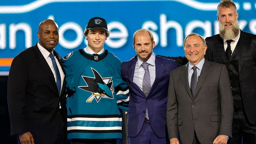 Macklin Celebrini with Sharks brass