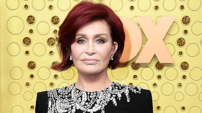 Sharon Osbourne at the Emmys in a black dress with crystals embroidery