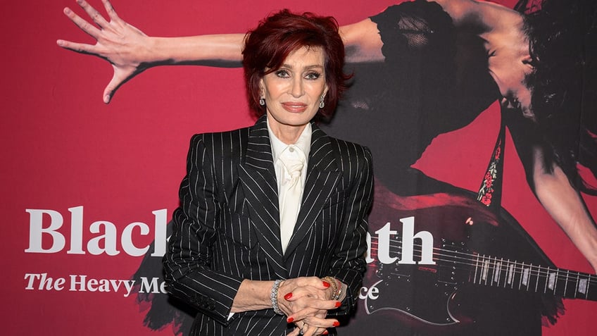 Sharon Osbourne in a pin-stripe blazer on the carpet in England