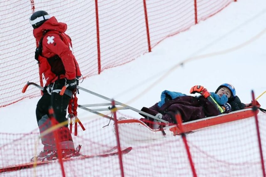 American Mikaela Shiffrin is taken off the course after crashing out of the alpine World C