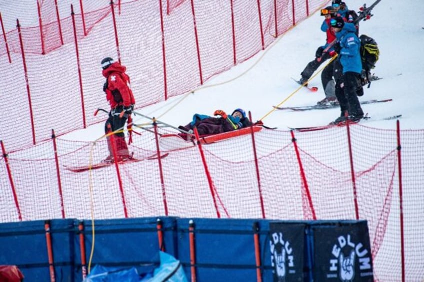 American Mikaela Shiffrin is taken off the course after crashing out of the alpine World C