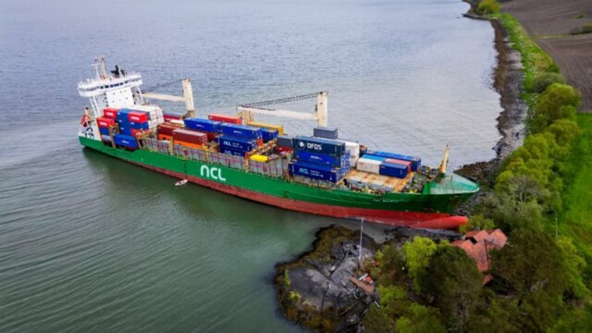 A cargo ship has been freed after running aground near a house in Norway