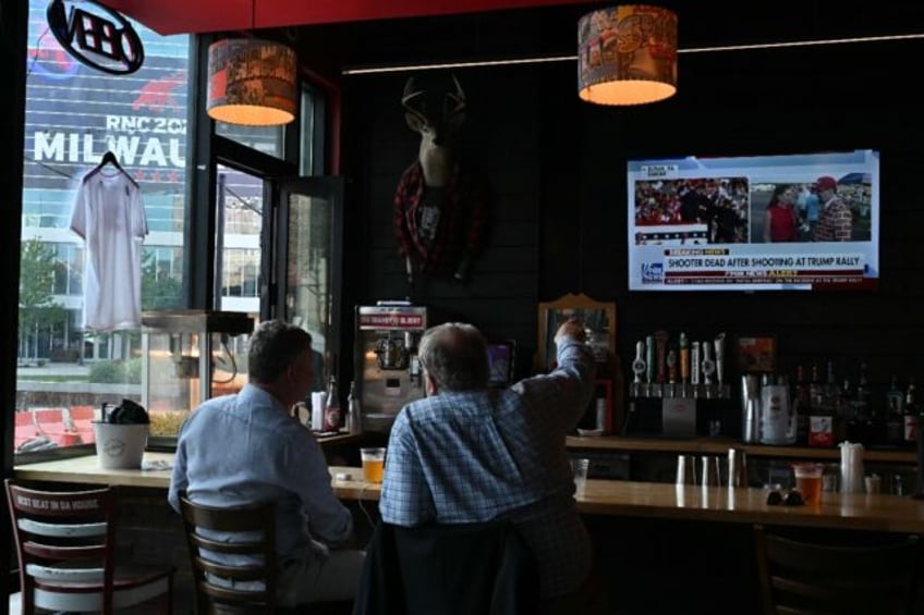 Milwaukee residents watch news of the assassination attempt on Donald Trump at a bar