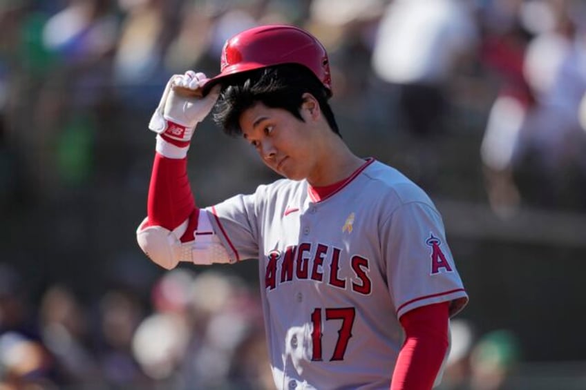 shohei ohtanis agent says the star plans to continue as a pitcher and hitter after his elbow heals