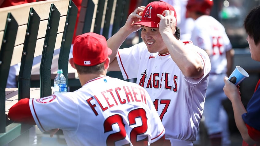 Shohei Ohtani and David Fletcher in the dugout