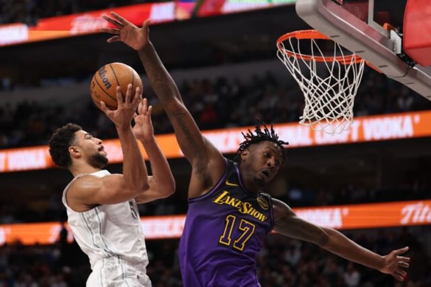 Quentin Grimes of the Dallas Mavericks makes a move to the basket against Dorian Finney-Sm