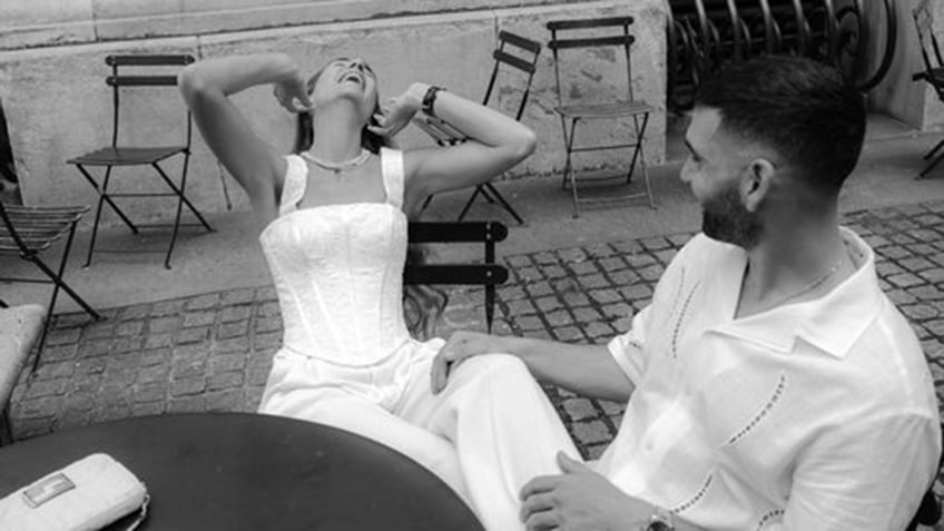 A bride and groom laughing on their wedding day