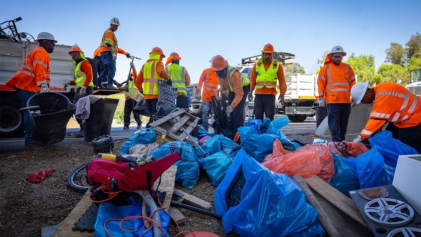 Governor Gavin Newsom along with Caltrans clean up an encampment site near Paxton Street and Remick Avenue in Los Angeles as the states Clean California initiative continues on Thursday, Aug. 8, 2024 in Los Angeles, CA.