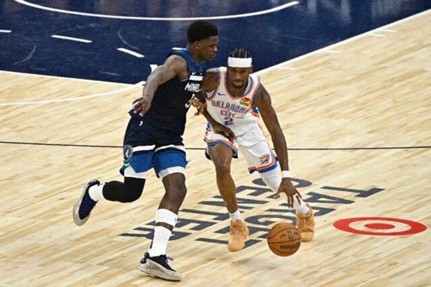 Canadian Shai Gilgeous-Alexander of the Oklahoma City Thunder, right, and American Anthony