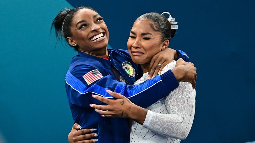 Simone Biles and Jordan Chiles embrace