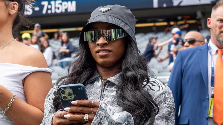 Simone Biles on sideline