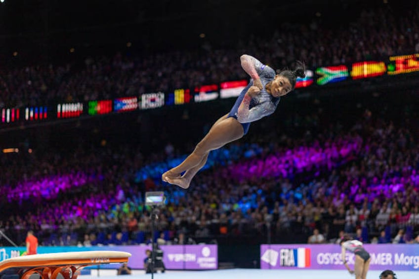 simone biles leads us women to record 7th straight team title at gymnastics world championships