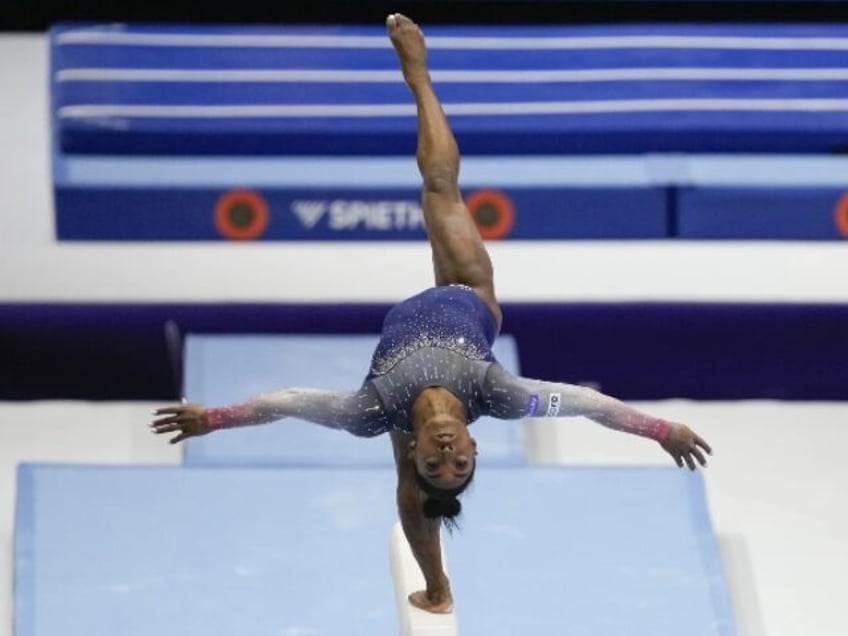 simone biles leads us women to record 7th straight team title at gymnastics world championships