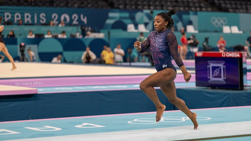 Simone Biles performs vault