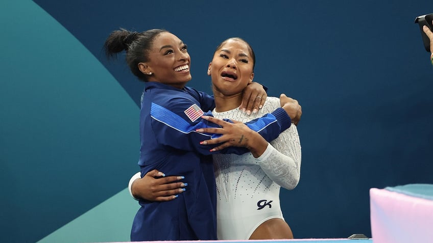 Simone Biles and Jordan Chiles embrace