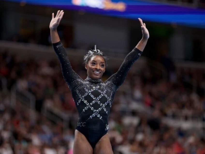 simone biles reaches a record 6th world championship after thrilling win