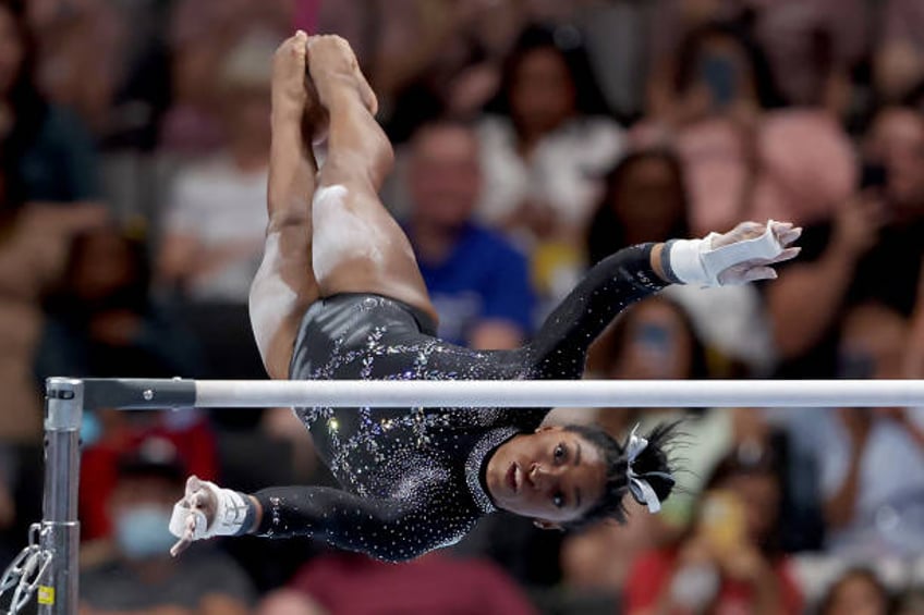 simone biles reaches a record 6th world championship after thrilling win