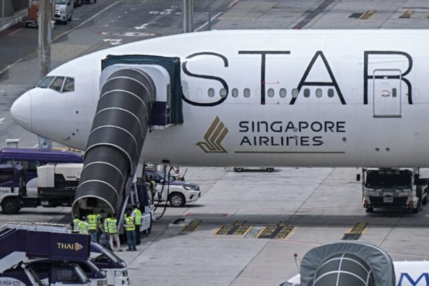 Singapore Airlines said Friday it has tightened seatbelt rules on its flights after one pa