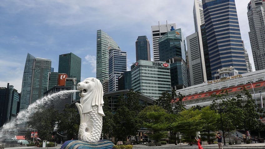 singapore police investigating money laundering scheme uncover more gold bars luxury watches