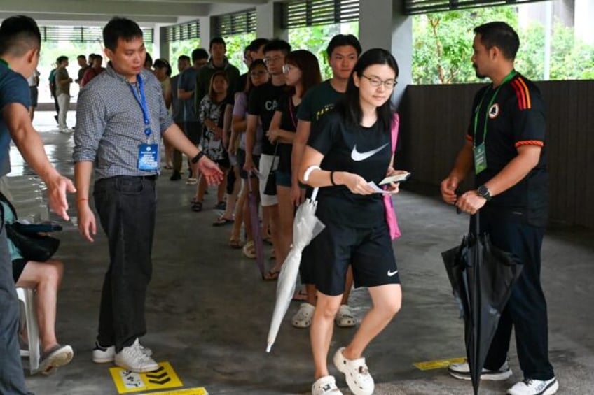 Polls opened at 8:00 am (0000 GMT) for 12 hours of voting, with some results expected to s