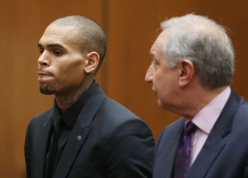 Chris Brown, pictured in court in 2013, has filed a $500 million lawsuit against Warner Br