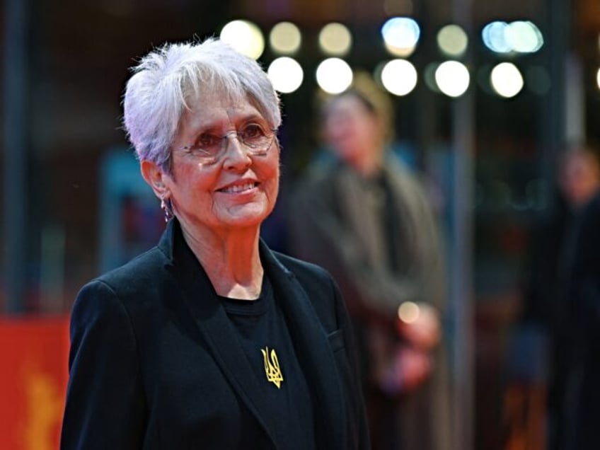 US singer-songwriter and activist Joan Baez poses on the red carpet upon arrival for the f