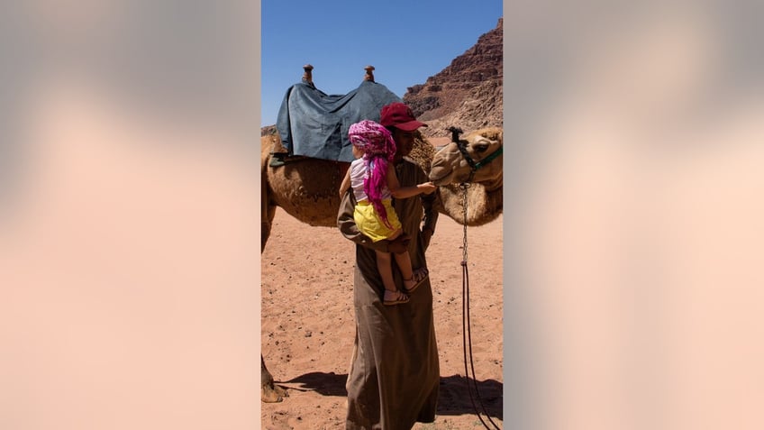 Noack and baby by camel