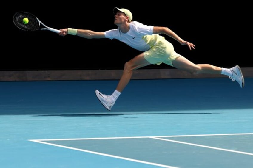 Italy's Jannik Sinner hits a return against Chile’s Nicolas Jarry at the Australian Open