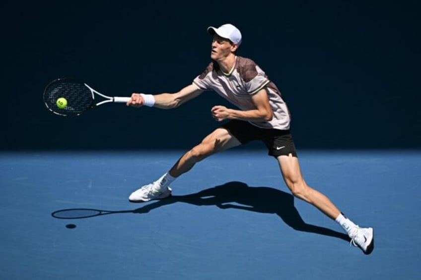 Italy's Jannik Sinner hits a return against Netherlands' Botic van de Zandschulp at the Australian Open