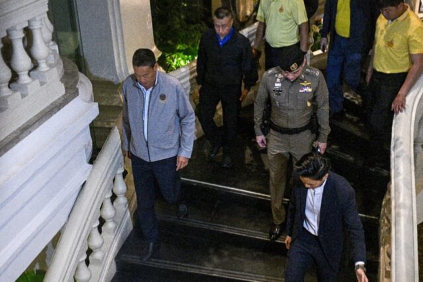 Thailand's Prime Minister Srettha Thavisin (L) visits after an incident, in which six bodi
