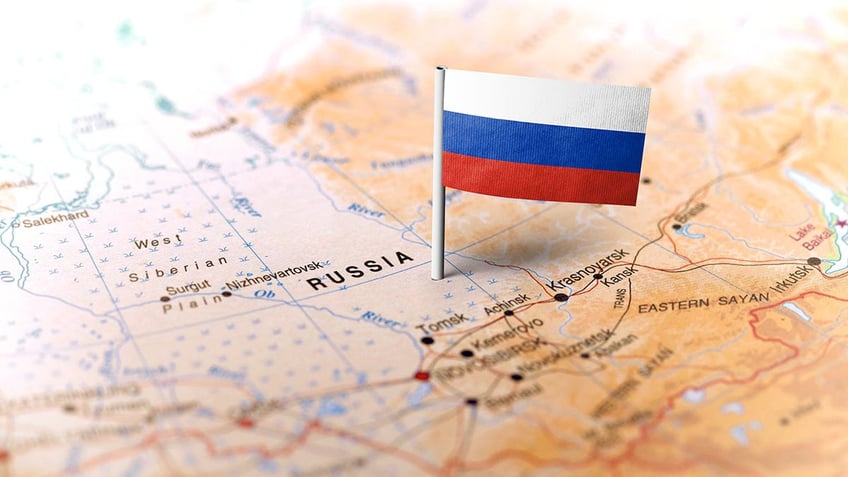 A map with a Russian flag stuck in it