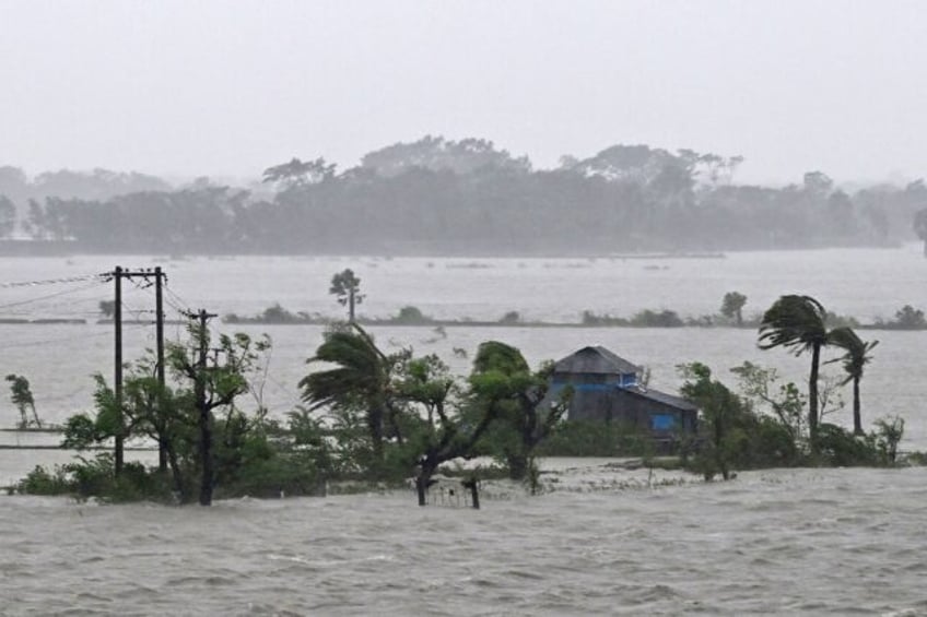 Marooned houses in Bangladesh are seen during heavy rainfall in Patuakhali on May 27 after