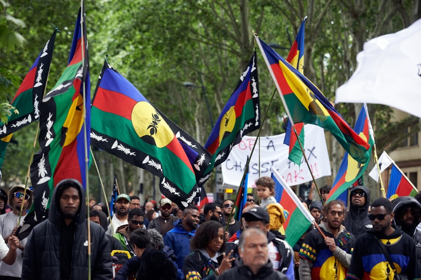 New Caledonians (Kanaks) of Toulouse are taking to the streets in protest against the constitutional revision of the French Constitution by French President Macron to expand the electorate who can vote in local elections. Kanaks are saying they are already outnumbered by French people coming from the metropole and that the widening launched by Macron will be catastrophic for them. They are explaining this is plain colonialism. Since the vote on the law to widen the electorate, riots are happening in New Caledonia and the French government is sending riot police and military to quell the insurrection there. Five people have already died. In Toulouse, France, on May 18, 2024. (Photo by Alain Pitton/NurPhoto via Getty Images)